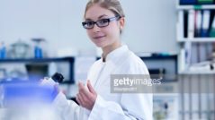 Scientist young woman working in a lab for plants