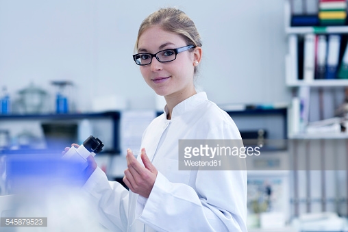 Scientist young woman working in a lab for plants